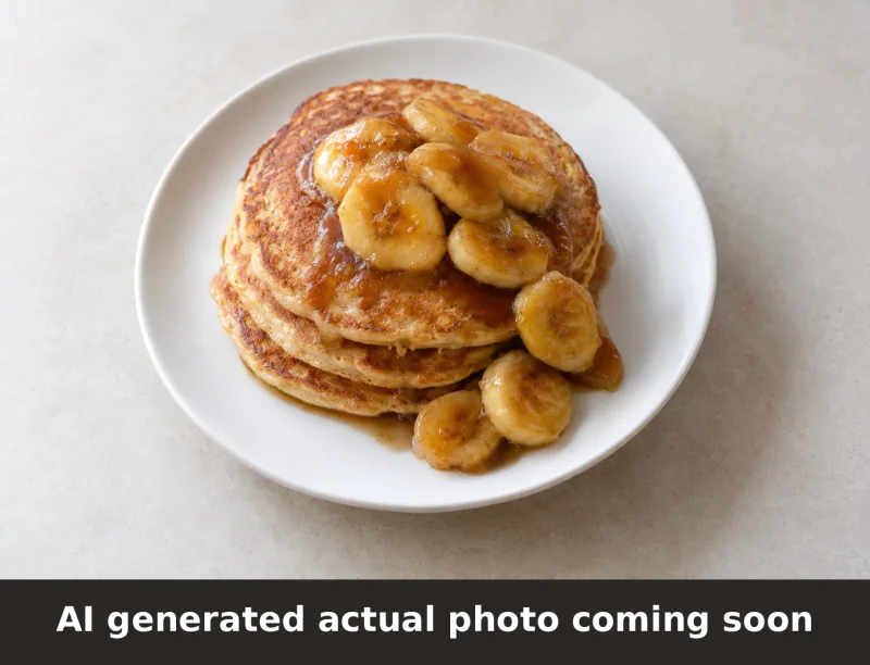 Banana Foster Protein Pancakes Plate. AI-generated placeholder image, not a photo of the actual dish.